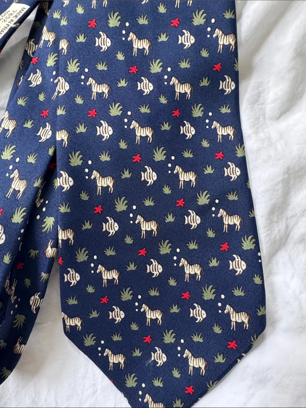 Hermès, navy silk necktie with fish and zebras and starfish MINT